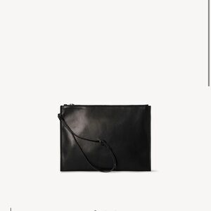 The ROW wristlet pouch in leather